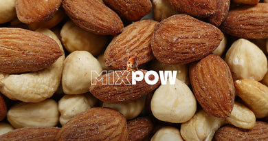 Amandes et noisettes gros plan — fruits secs qui soutiennent le métabolisme et la dépense calorique